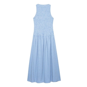 Close-up of blue gingham maxi dress featuring smocked bodice and woven cotton texture