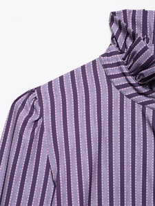 Detail of purple striped shirt featuring ruffled high collar and polka dot texture
