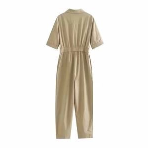 Detail view of khaki short-sleeve jumpsuit showing back collar and elastic waist design