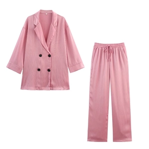 Elegant pink two-piece women's lounge set with double-breasted jacket and drawstring pants