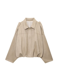 Detail of light khaki suede jacket showing lapel collar and gathered shoulder design