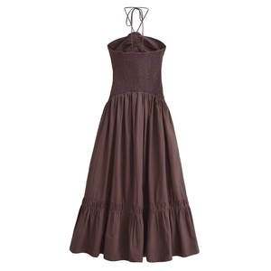 Brown halter neck dress featuring a smocked back and tiered ruffle hemline design