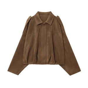 Detail of brown faux suede jacket featuring epaulettes and pleated front design