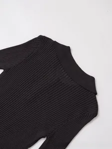 Macro shot of vertical rib-knit texture and collar detail on dark brown autumn sweater