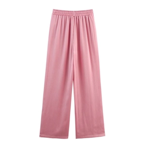 Detail of pink high-waisted wide-leg trousers with vertical fine pleated texture and elastic