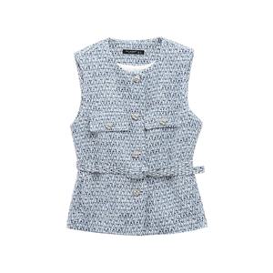 Macro detail of blue and white tweed vest texture with silver embossed metal buttons