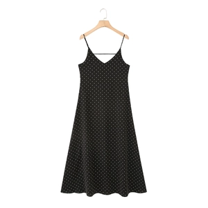 Elegant black and white polka dot sleeveless maxi dress with thin straps and V-neckline