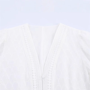 Elegant white French dress featuring a V-neckline with delicate lace and eyelet embroidery