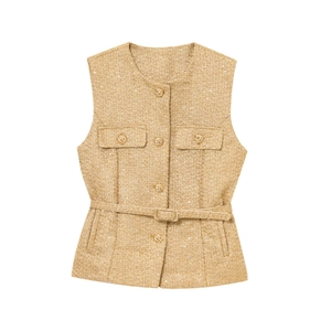 Close-up of mustard tweed texture vest featuring gold buttons and a matching belt