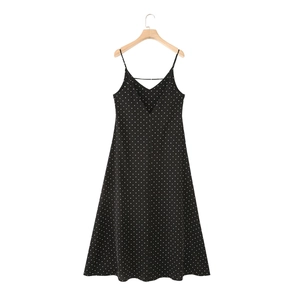 Elegant sleeveless black polka dot maxi dress with thin straps and a classic A-line silhouette