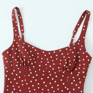 Red midi dress with white polka dots, sweetheart neckline and adjustable straps