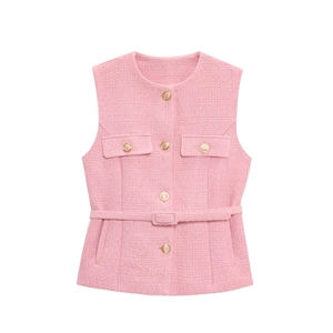 Detailed view of pink tweed vest featuring gold buttons and matching waist belt
