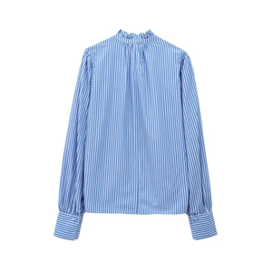 Detail of ruffled stand-up collar and vertical blue stripes on cotton blend shirt