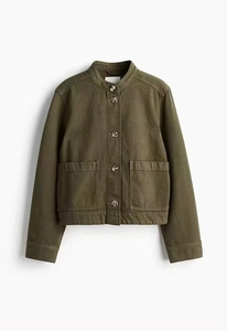 Detailed view of army green cropped jacket with stand collar and large front pockets