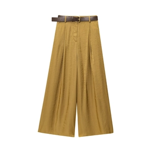 Elegant mustard yellow satin wide leg trousers with a slim dark brown leather belt