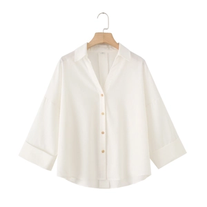 Detailed view of linen blend shirt with V-neck collar and natural wooden buttons