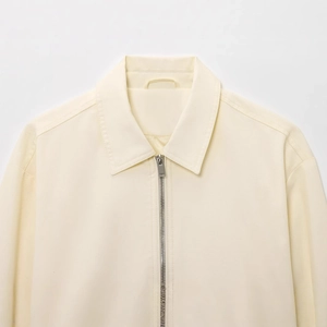 Minimalist beige bomber jacket with silver metal zipper and collar detail in high quality