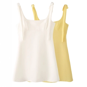 White and yellow gingham mini dress with bow straps and a chic French A-line silhouette