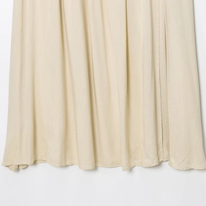 Chic beige midi skirt featuring a pleated texture design with matching waist belt