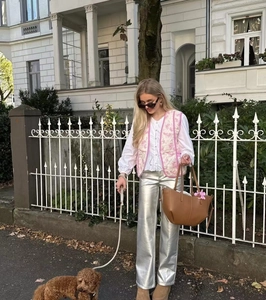 Floral quilted vest paired with silver metallic wide-leg pants for a stylish street look