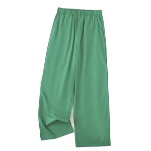 Detailed view of women's grass green high waist wide-leg trousers with elastic waistband