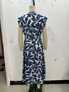 Detail of the back elastic ruched waist on a navy tropical print summer maxi dress