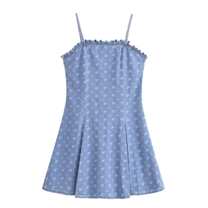 Detail of light blue denim floral dress featuring ruffled neckline and A-line cut design