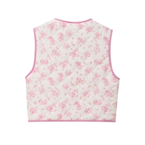 Women's quilted vest featuring a white floral print with pink trim and diamond stitching