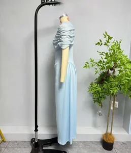 Detail of light blue mesh patchwork sleeveless slim dress with side ruched pleats