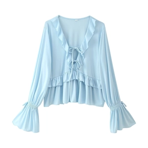 Light blue V-neck long sleeve chiffon top with ruffle details and front tie closure