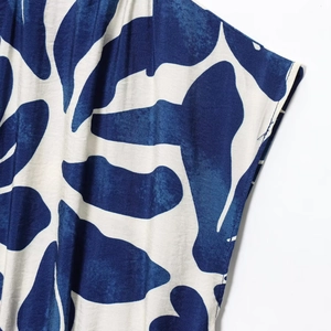 Women's summer V-neck sleeveless dress featuring blue and white floral leaf prints