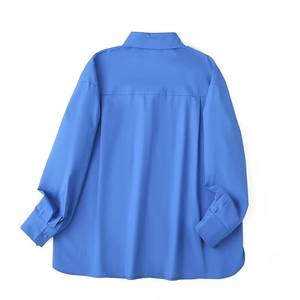 Detail view of the royal blue long sleeve shirt back with box pleats and curved hemline