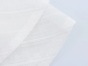 Detailed macro view of white breathable fabric with sophisticated woven texture stripes