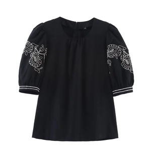 Women black short sleeve top with white floral embroidery and puff sleeves