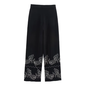Women's summer black high waist wide leg pants with white floral embroidery at the hemline