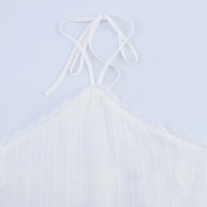 Elegant white ribbed halter top with lace trim and tie-neck details for summer