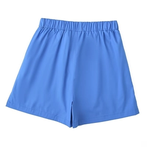 Detail of blue high-waisted A-line casual shorts with elastic pleated waistband design