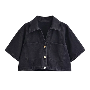 Short-sleeved black denim jacket with gold buttons and symmetrical chest pockets