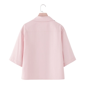 Back view of a minimalist light pink short-sleeved shirt with drop shoulder and classic collar