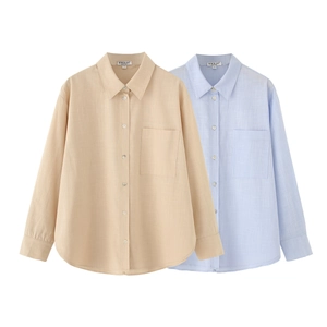 Detail of linen texture and pocket on loose-fit shirts in yellow and blue colors