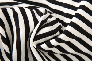 Close-up of high-quality black and white striped knit fabric texture and elasticity