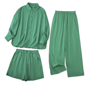 Three-piece mint green set with button-down shirt, wide-leg trousers and elastic shorts