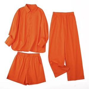 Three-piece bright orange casual set with button-down shirt, wide-leg pants and shorts