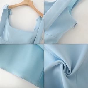 Detail of light blue camisole with bow shoulder straps and side invisible zipper