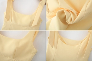 Detail view of square neck, tie-shoulder straps and side invisible zipper on yellow top
