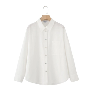 Classic white linen long sleeve shirt with chest pocket and pearl buttons on wooden hanger