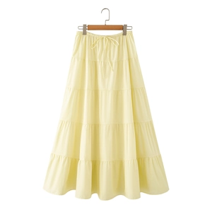 Minimalist light yellow tiered maxi skirt with layered ruffles and drawstring high waist