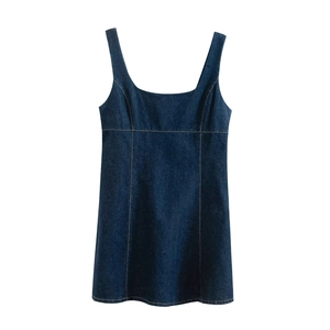 Detailed view of dark blue denim mini dress featuring square neck and contrast stitching