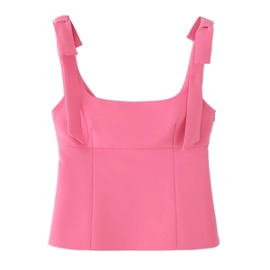 Pink fitted camisole top with large shoulder bow accents and square neckline on white background