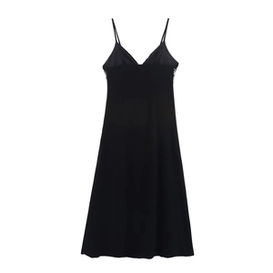 Detailed view of black camisole dress featuring white lace side trim and V-neckline